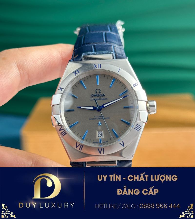 Đồng hồ Omega Constellation vỏ thép mặt xám cọc số xanh